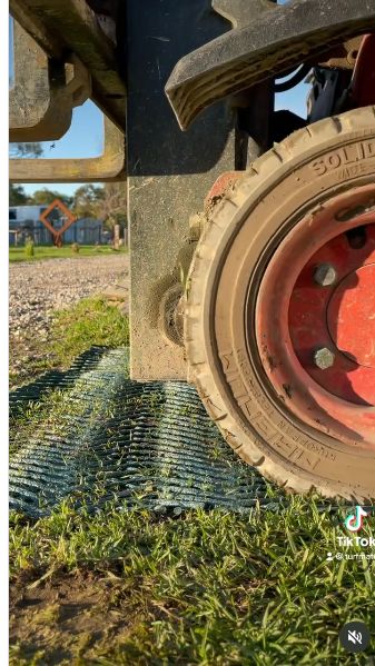 A heavy forklift tyre resting on grass reinforcement mesh at Turfmate.