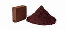 Compressed cocopeat block beside a pile of fine coir pith