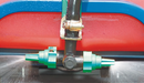 Double-sided boomless sprayer nozzles fitted to a central connector